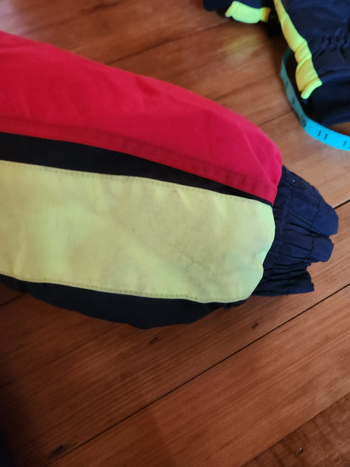 90s Red, Black, and Yellow Ski Jacket and Gloves